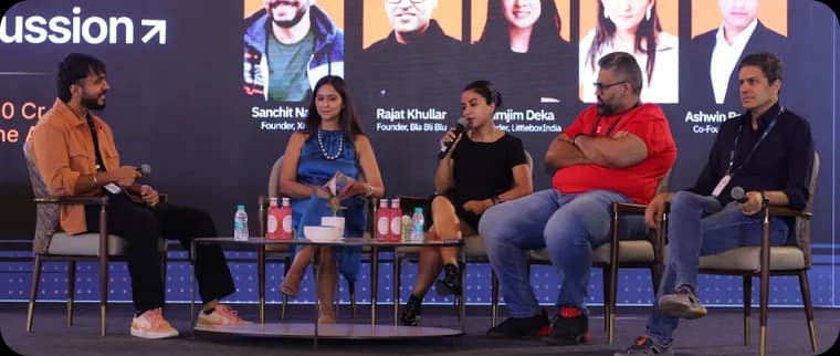 A full panel of speakers on stage